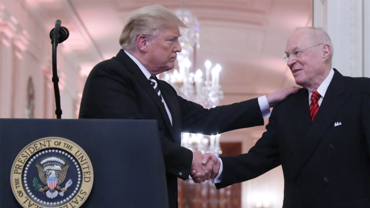 President Donald Trump shakes hands with retired Justice Anthony Kennedy