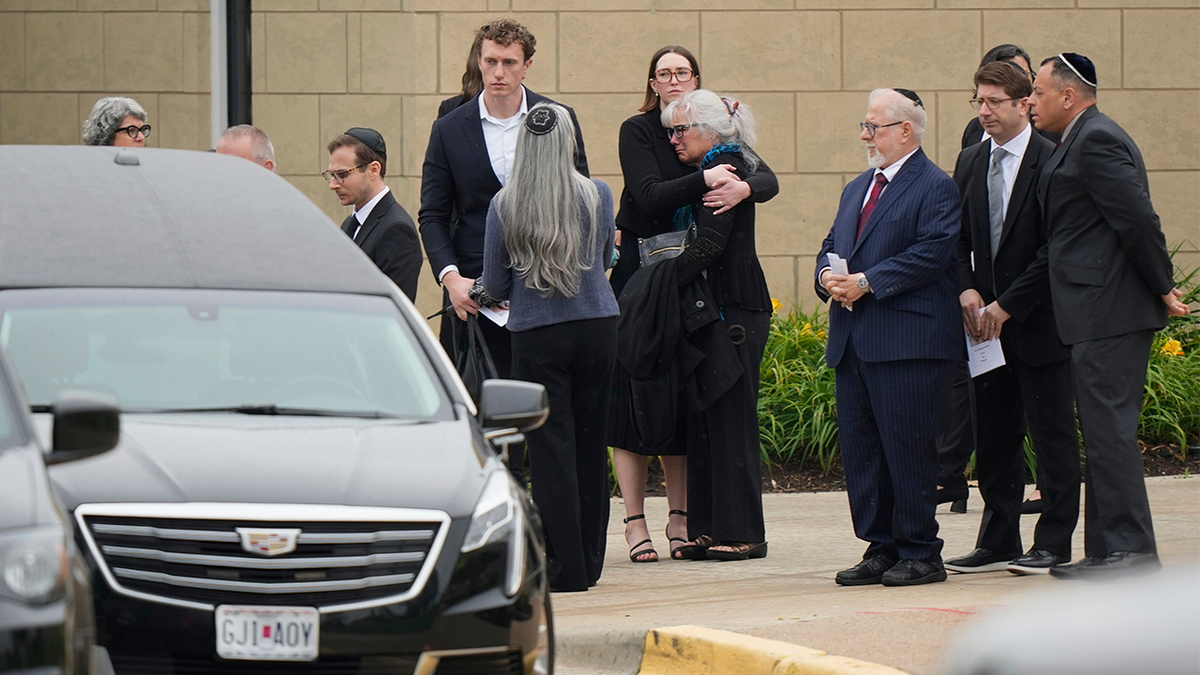 Family and friends gather outside Congregation Beth Torah after a funeral for Sarah Milgrim, a staffer at the Israeli Embassy who was killed outside a Washington Jewish museum, May 27, 2025, in Overland Park, Kansas.