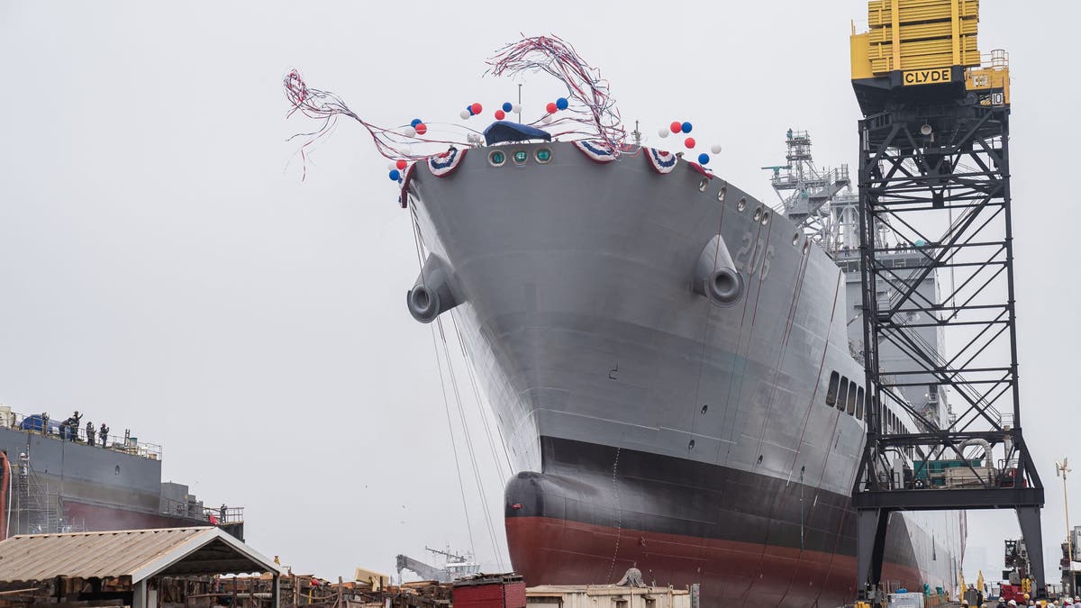 USNS Harvey Milk departs the General Dynamics NASSCO shipyard after a ceremonial address in San Diego, California on November 6, 2021.