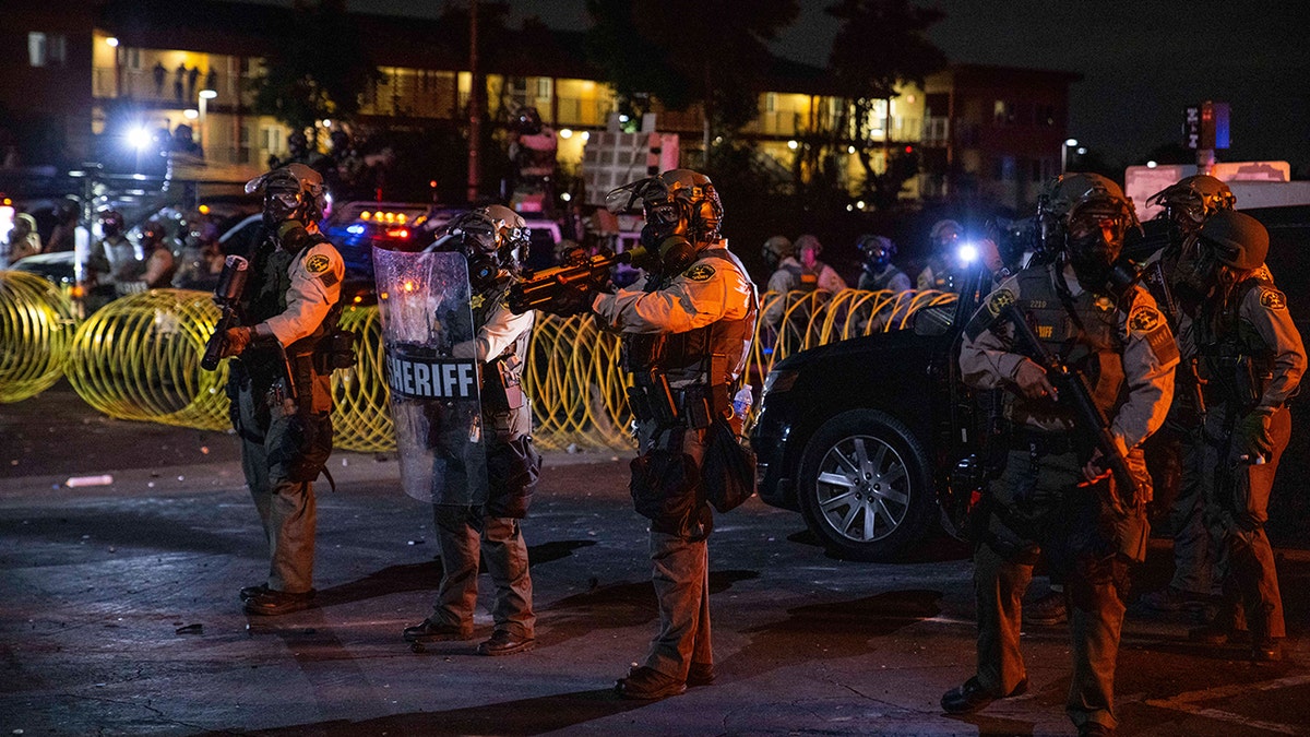 LA deputies with riot shields