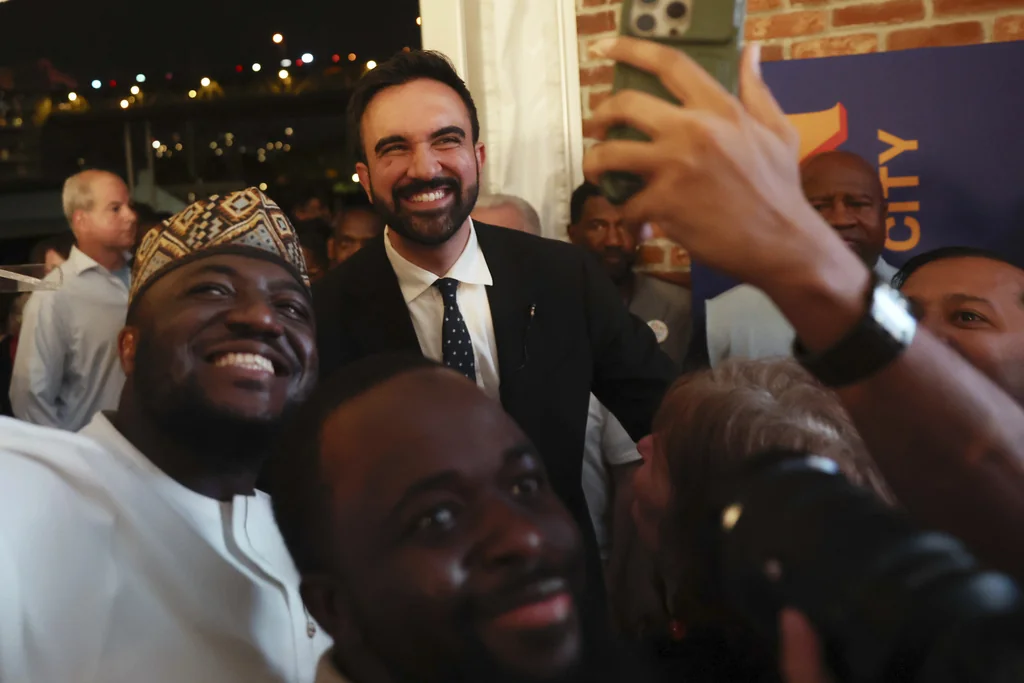Democratic mayoral candidate Zohran Mamdani takes selfies with supporters after speaking at his primary election party, Wednesday, June 25, 2025, in New York. (AP Photo/Heather Khalifa)