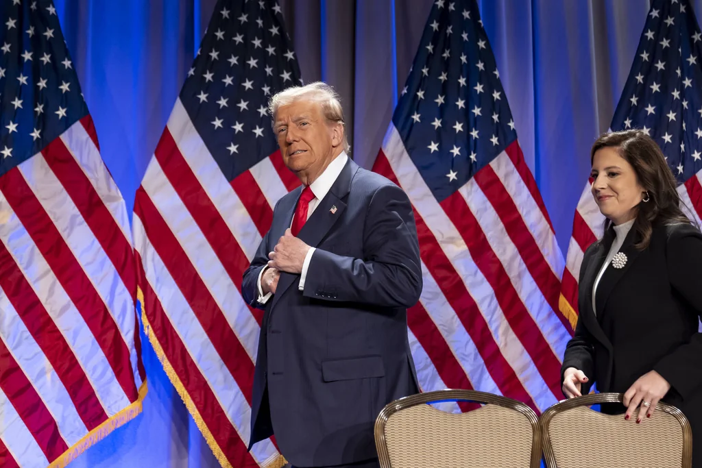 President-elect Donald Trump arrives to speak at a meeting of the House GOP conference, followed by Rep. Elise Stefanik, R-N.Y.