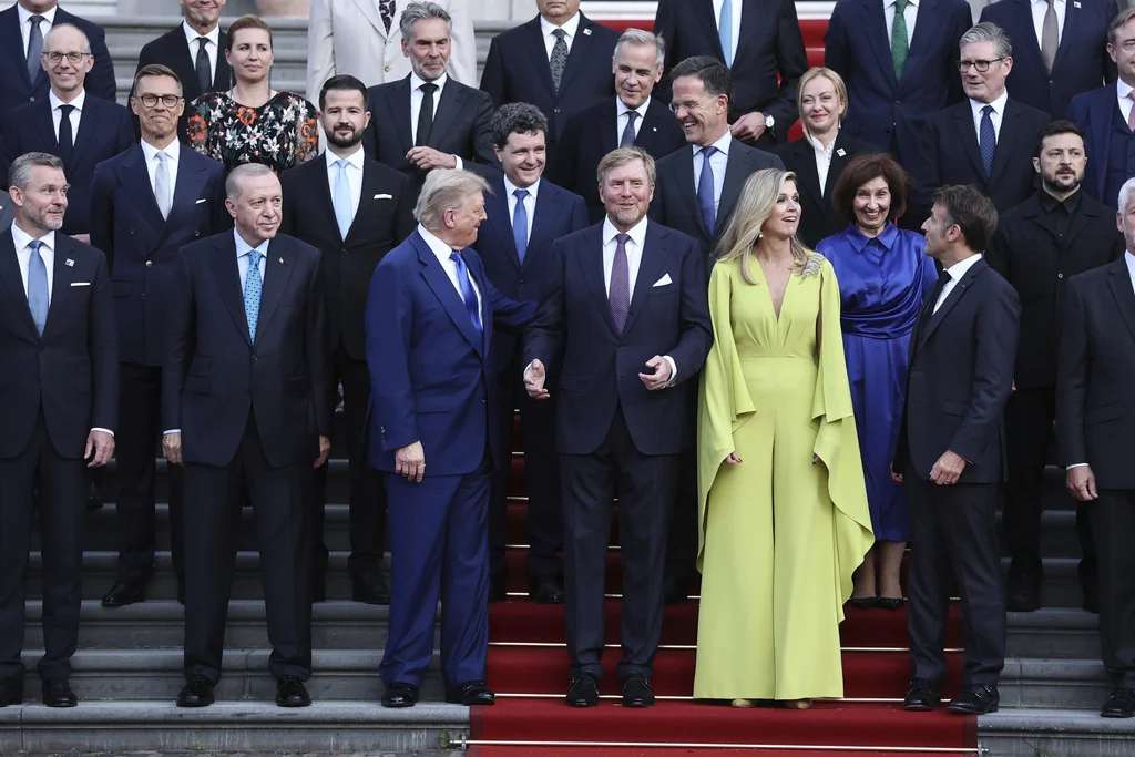 President Donald Trump, front third left, poses with Netherland's King Willem Alexander, Netherland's Queen Maxima and NATO heads of state and government during a group photo at the Paleis Huis ten Bosch on the sidelines of the NATO summit in The Hague, Netherlands, Tuesday, June 24, 2025. (Christian Hartmann, Pool Photo via AP)