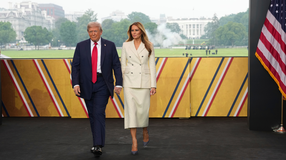 President Donald Trump and first lady Melania Trump arrive for a parade to honor the Army's 250th anniversary, coinciding with Trump's 79th birthday, June 14, 2025, in Washington.