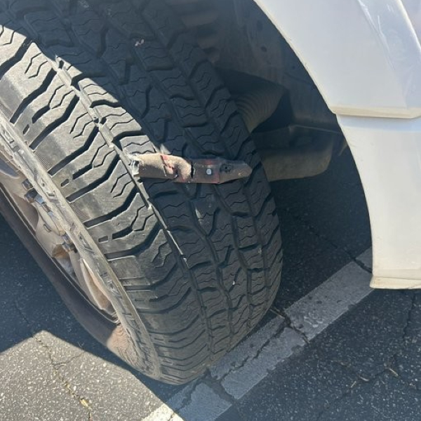 Federal Law Enforcement Vehicle's Tire Damaged by Spikes (U.S. Border Patrol)
