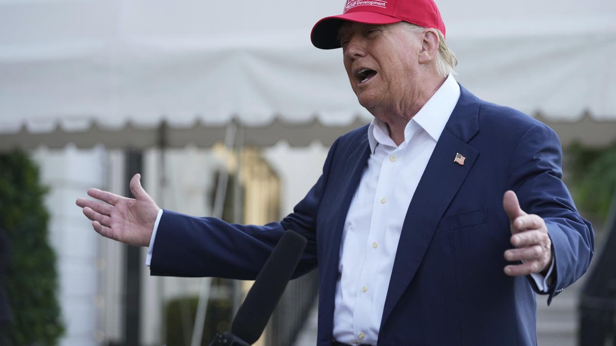 President Donald Trump speaks to the media before walking across the South Lawn of the White House, July 1, 2025. (AP Photo/Mark Schiefelbein)