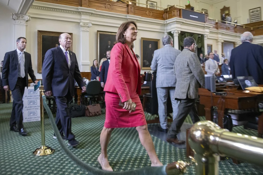 From left, Texas Senators Nathan Johnson, D-Dallas, Juan "Chuy" Hinojosa, D-McAllen, and Angela Paxton, R-McKinney, walk onto the Senate floor at the beginning of day 5 of Texas Attorney General Ken Paxton's impeachment trial at the Texas State Capitol in Austin, Texas, Monday, Sept. 11, 2023. Ken Paxton pleaded not guilty last week to numerous articles of impeachment.