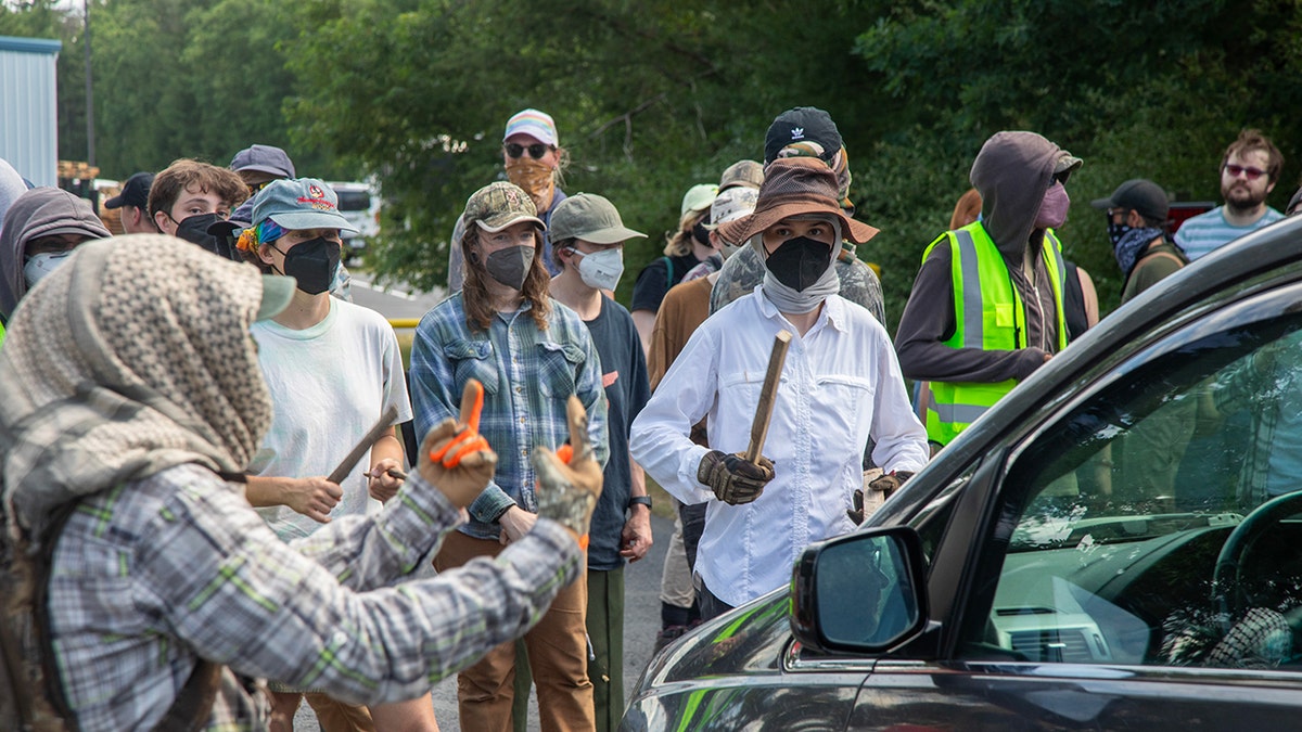 Masked protesters at a Michigan ICE facility
