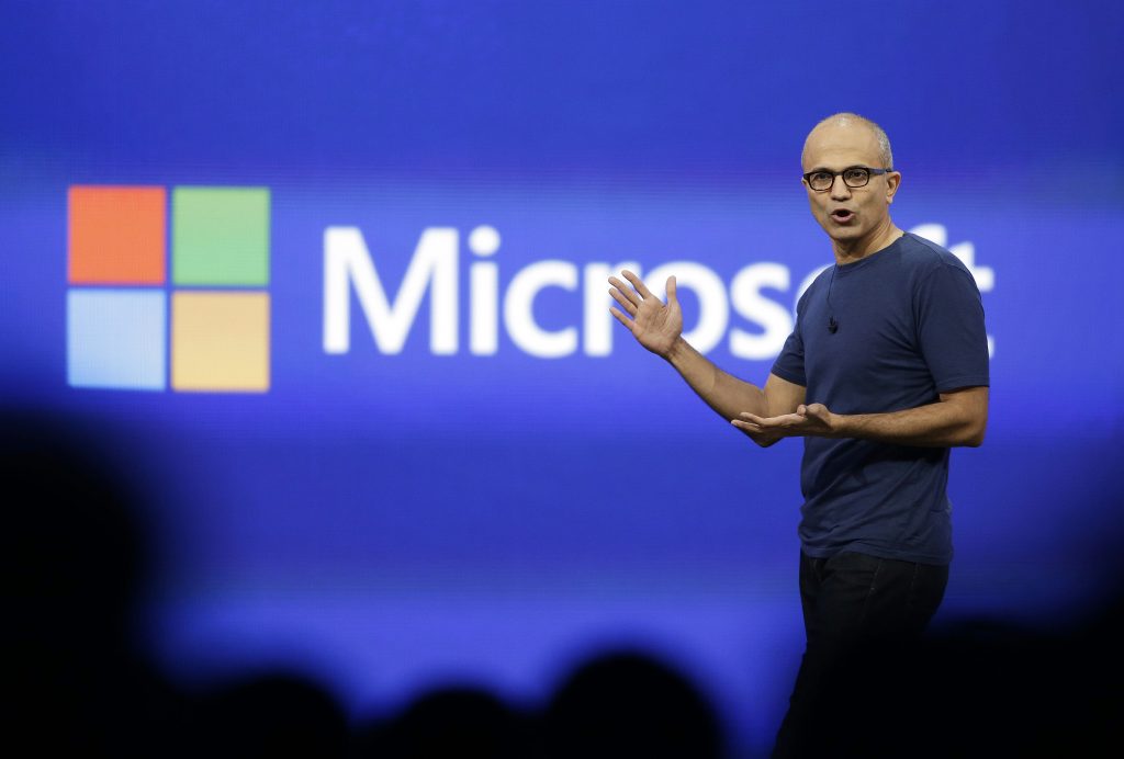 In this April 2, 2014, photo, Microsoft CEO Satya Nadella gestures during the keynote address of the Build Conference in San Francisco. 