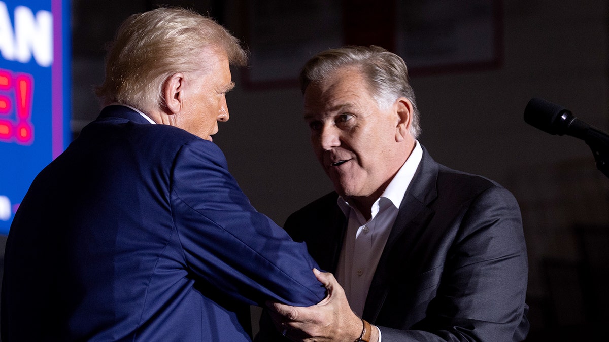 Former President Donald Trump and former Rep. Mike Rogers in 2024