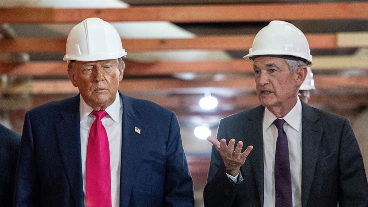 President Donald Trump speaks with Federal Reserve chair Jerome Powell (right) as he visits the Federal Reserve in Washington, July 24, 2025. 