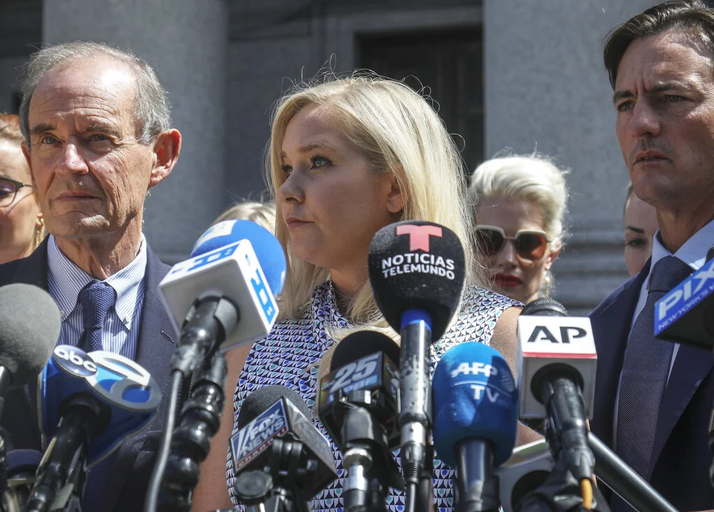 In this Aug. 27, 2019 file photo, Virginia Giuffre, center, who says she was trafficked by sex offender Jeffrey Epstein, holds a news conference outside a Manhattan court in New York. On Monday, Aug. 9, 2021, Giuffre sued Prince Andrew saying he sexually assaulted her when she was 17. Lawyers for Giuffre filed the lawsuit in Manhattan federal court. 