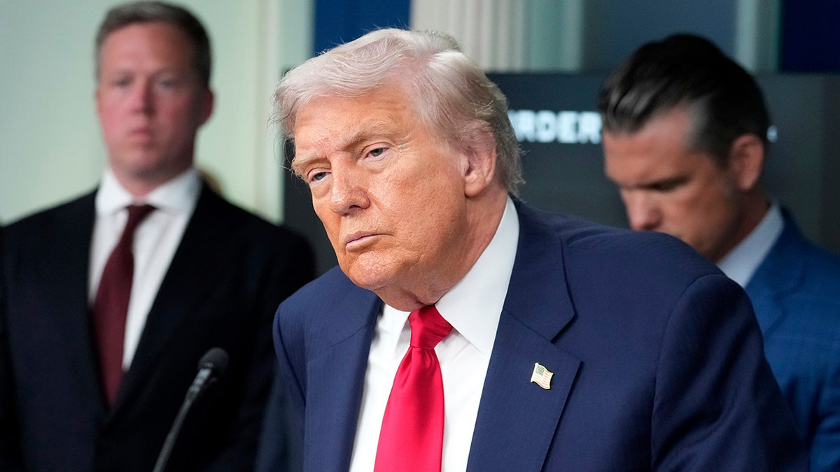 Donald Trump talks to the media