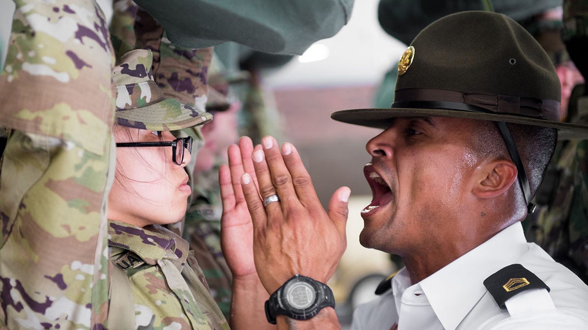 Army basic training recruit being yelled at during a shark attack