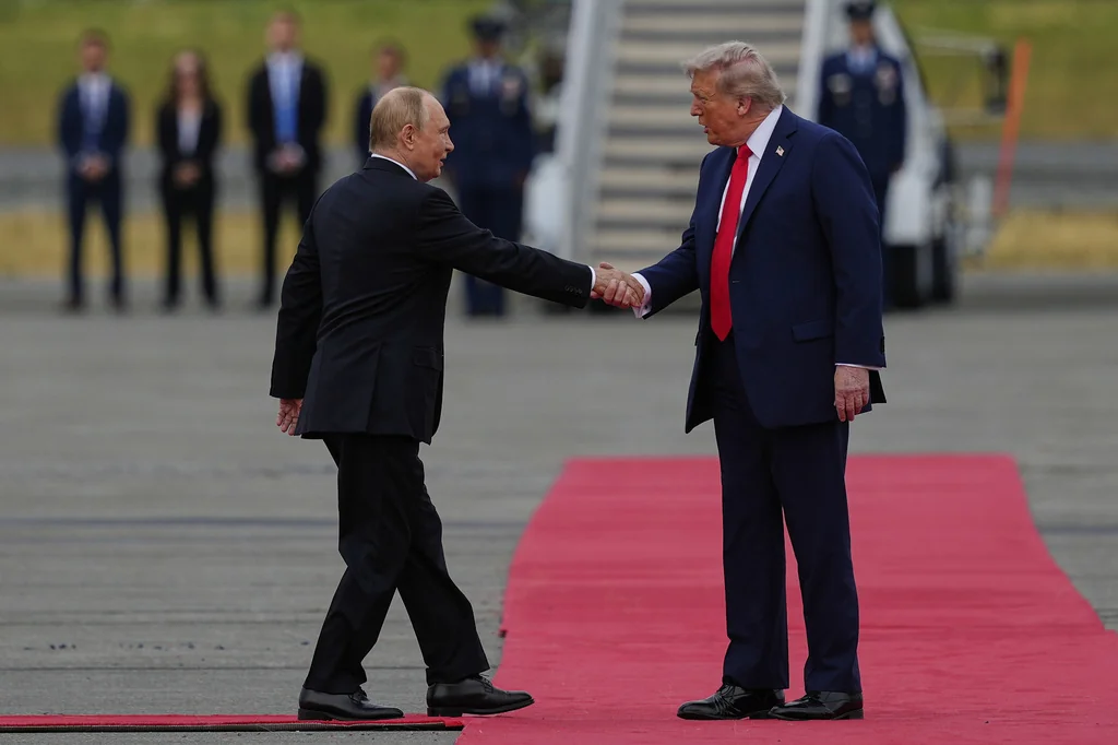 President Donald Trump greets Russia's President Vladimir Putin Friday, Aug. 15, 2025, at Joint Base Elmendorf-Richardson, Alaska. (AP Photo/Julia Demaree Nikhinson)