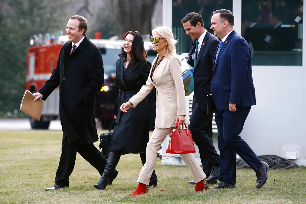 White House Political Director Brian Jack, from left, Deputy Staff Secretery Catherine Keller, Counselor to the President Kellyanne Conway, aide John McEntee and White House Social Media Director Dan Scavino walk across the South Lawn of the White House in Washington, Thursday, Jan. 23, 2020, before boarding Marine One for a short trip to Andrews Air Force Base, Md., and then on to Doral, Fla., for the Republican National Committee's winter meeting. (AP Photo/Patrick Semansky)