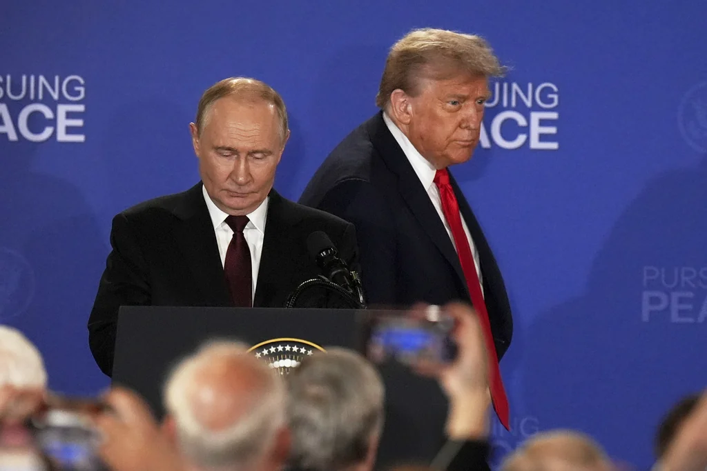 President Donald Trump, right, Russia's President Vladimir Putin arrive for a joint press conference at Joint Base Elmendorf-Richardson, Alaska, Friday, Aug. 15, 2025. (AP Photo/Jae C. Hong)