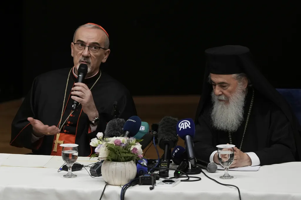 Latin Patriarch Cardinal Pierbattista Pizzaballa, left, and Greek Orthodox Patriarch Theophilos III, right, attend a press conference on Tuesday, July 22, 2025, in Jerusalem following their visit to the Gaza Strip.