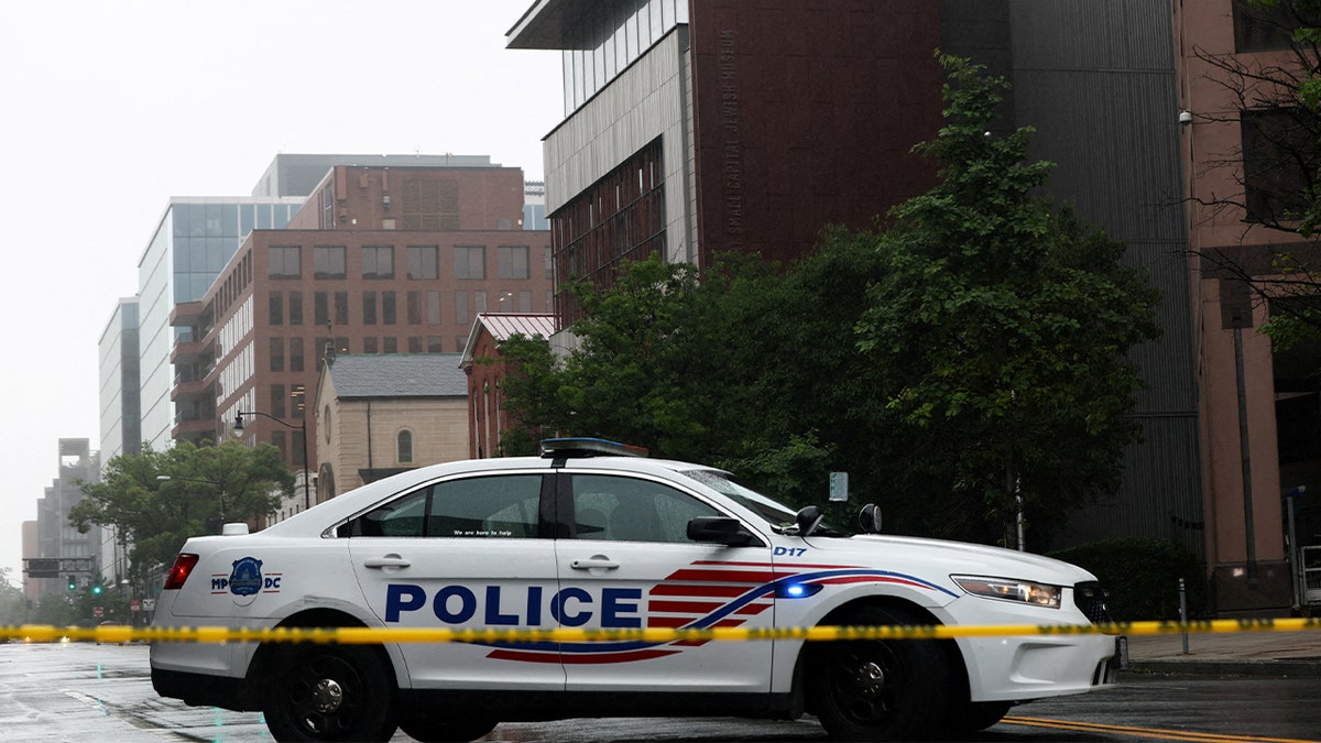 Police outside seen where a young couple was shot and killed in Washington, D.C.
