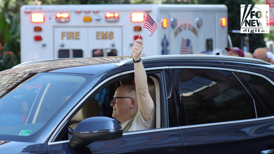Protester holds American flag at protest