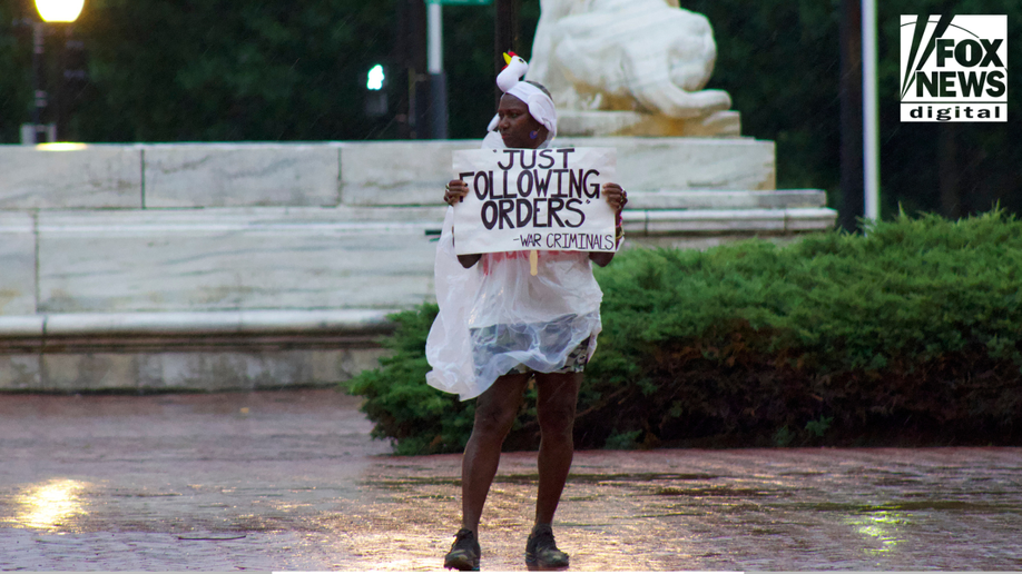 Protest stands in the rain at Union Station