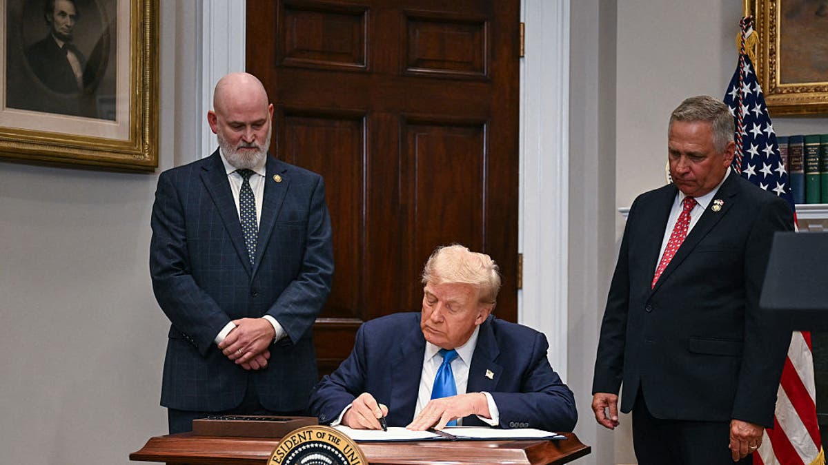 President Donald Trump signs the VA Home Loan Program Reform Act in the Roosevelt Room of the White House in Washington, July 30, 2025. (Jim Watson/AFP via Getty Images)