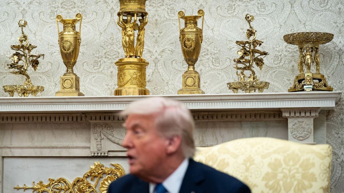 Gold decor on Trump's fireplace in the Oval Office