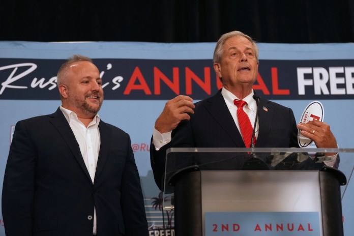 South Carolina Lt. Gov. Pamela Evette, second from left, speaks to a constituent as Attorney General Alan Wilson, right, walks behind her. Evette and Wilson, both running for the GOP gubernatorial nomination, spoke at Rep. Russell Fry's "Freedom Fry" event Monday, Aug. 18, 2025, in Myrtle Beach, S.C. (AP Photo/Meg Kinnard)