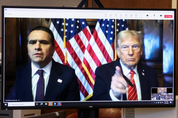 President-elect Donald Trump, right, appears remotely with attorney Todd Blanche for a sentencing hearing in front of New York State Judge Juan Merchan in the criminal case in which he was convicted in 2024 on charges involving hush money paid to a porn star, at New York Criminal Court in New York, Jan. 10, 2025. (Brendan McDermid/Reuters via AP, Pool)