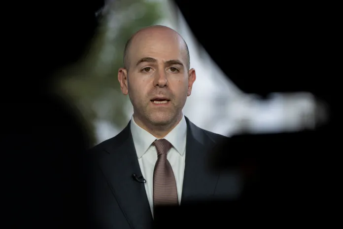 Stephen Miran, chairman of the Council of Economic Advisors and President Donald Trump's pick to serve on the Federal Reserve, speaks during a television interview at the White House, Tuesday, Aug. 12, 2025, in Washington. (AP Photo/Alex Brandon)