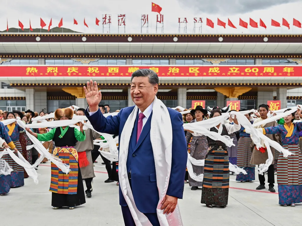 In this photo released by Xinhua News Agency, Chinese President Xi Jinping waves as he arrives at Lhasa in western China's Tibet Autonomous Region on Wednesday, Aug. 20, 2025, to attend an event to mark the 60th anniversary of the consolidation of Beijing's long-contested rule over the Himalayan territory. (Yan Yan/Xinhua via AP)