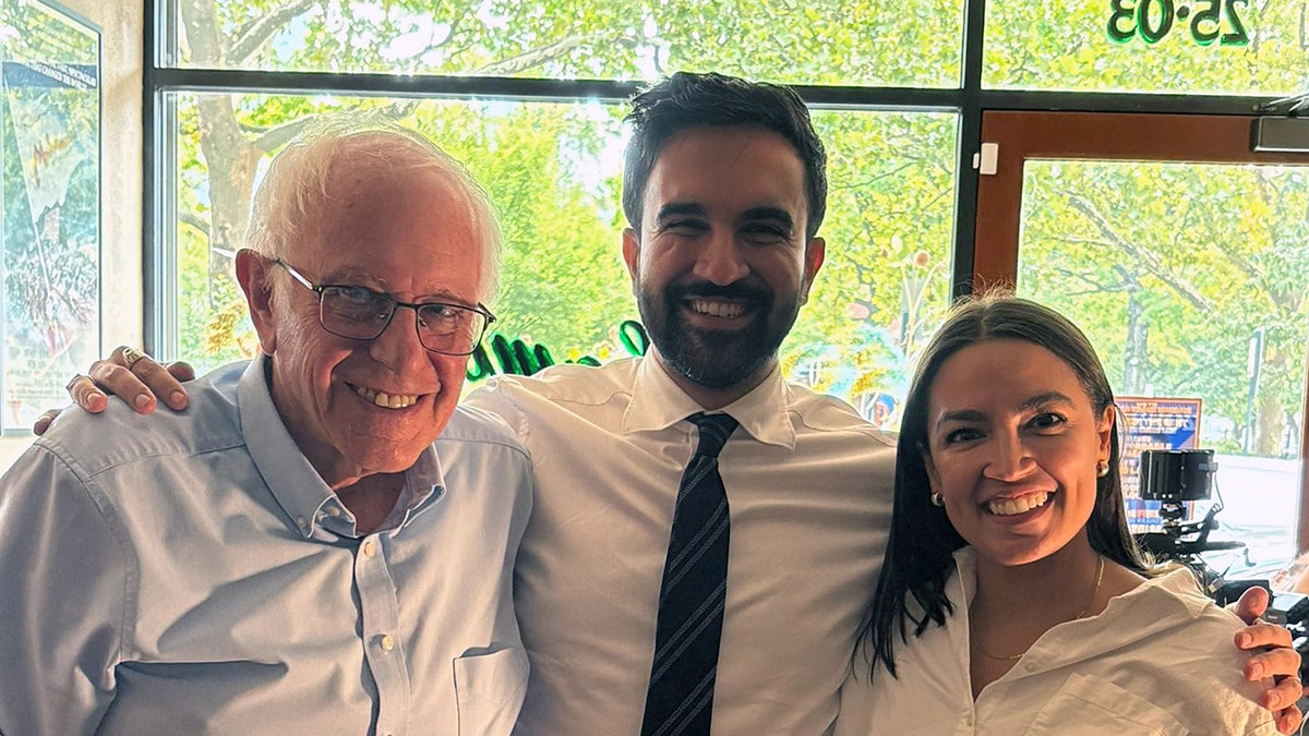 Bernie Sanders, Zohran Mamdani and Alexandria Ocasio-Cortez pose together in Astoria, Queens