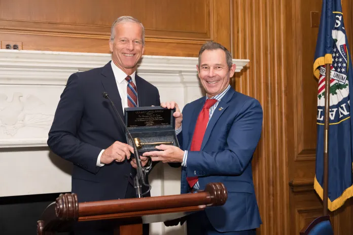 Senator Thune presents the Golden Gavel to Senators Curtis and Moreno during their policy luncheon, in Washington, DC on September 3, 2025.