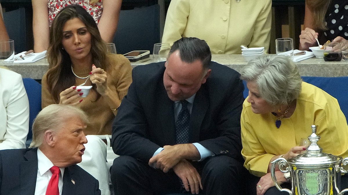 Dan Scavino and Erin Elmore with President Donald Trump and Susie Wiles