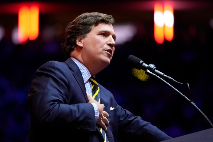Tucker Carlson speaks before Republican presidential nominee former President Donald Trump at a campaign rally.