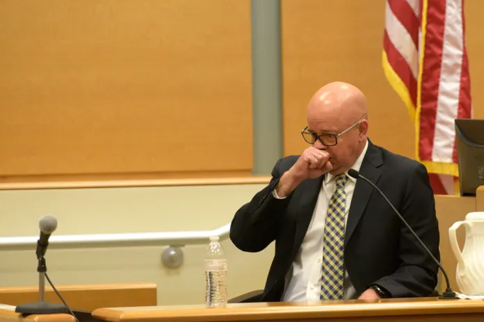 FBI agent William Aldenberg tries to compose himself while testifying during the first day of Alex Jones' Sandy Hook defamation damages trial at Waterbury Superior Court, Sept. 13, 2022, in Waterbury, Conn. (H John Voorhees III/Hearst Connecticut Media via AP, File)
