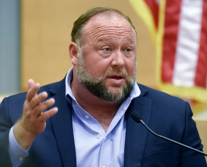 Conspiracy theorist Alex Jones takes the witness stand to testify at the Sandy Hook defamation damages trial at the Connecticut Superior Court in Waterbury, Conn., Sept. 22, 2022. (Tyler Sizemore/Hearst Connecticut Media via AP, Pool, File)