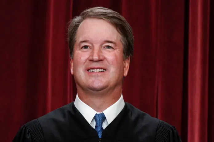 Associate Justice Brett Kavanaugh joins other members of the U.S. Supreme Court as they pose for a new group portrait at the Supreme Court building in Washington, Friday, Oct. 7, 2022. A federal judge in Maryland said Wednesday, Oct. 26, that there is a "very high likelihood" that he will order a mental evaluation for a California man charged with trying to assassinate Kavanaugh. (AP Photo/J. Scott Applewhite, File)