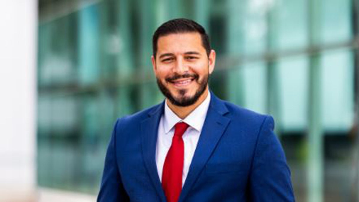 The head of the Florida Department of Education smiling