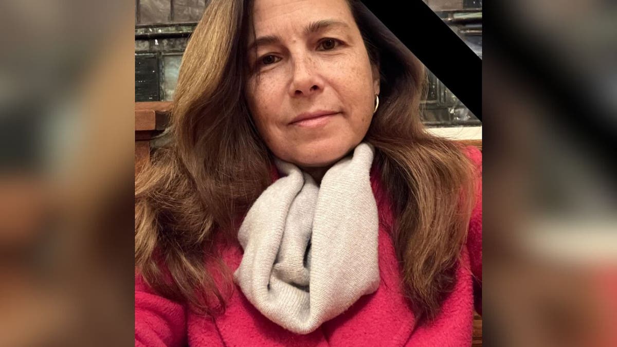 Nathalie Rose Jones in red coat and scarf