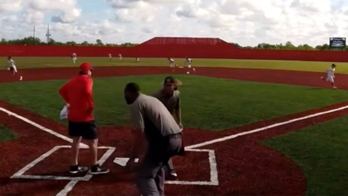 players run off field during shooting at baseball game