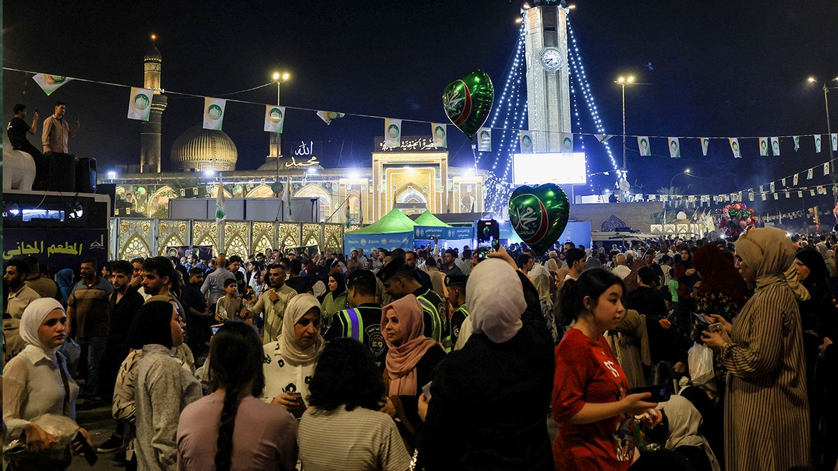 Muslims gather outside Abu Hanifa mosque during a ceremony marking the birth anniversary of Prophet Mohammed in Baghdad’s Adhamiya district, Iraq, Sept. 3, 2025.
