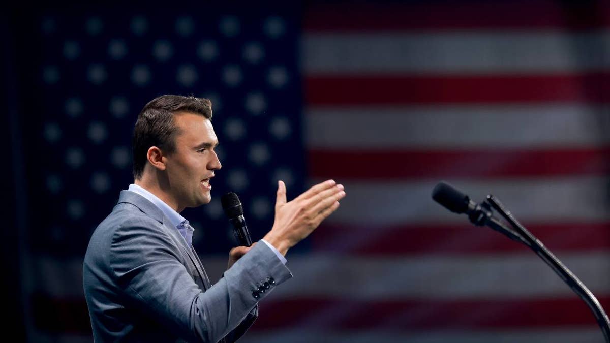 Charlie Kirk with USA flag in the background