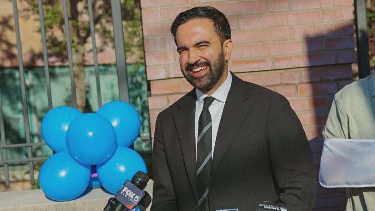 Mamdani smiling in an ad