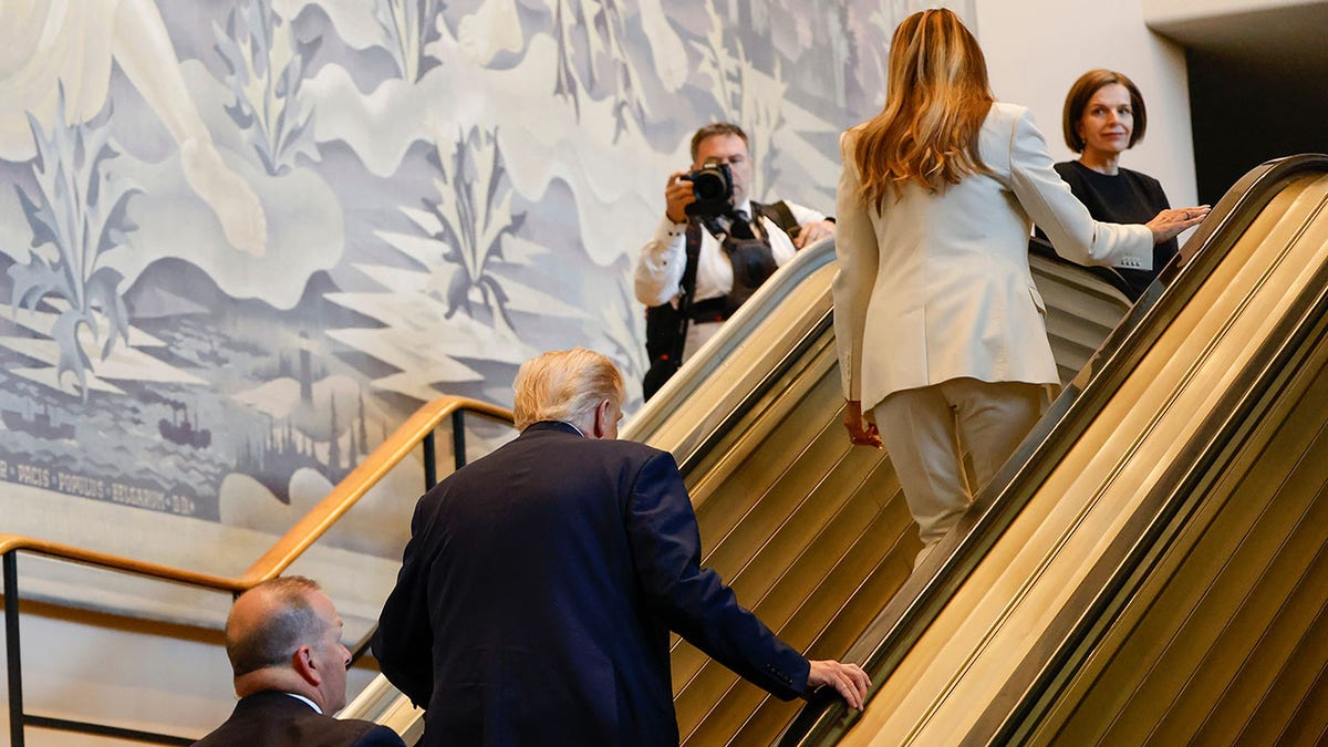 President Donald Trump and Melania Trump on an escalator at the U.N.