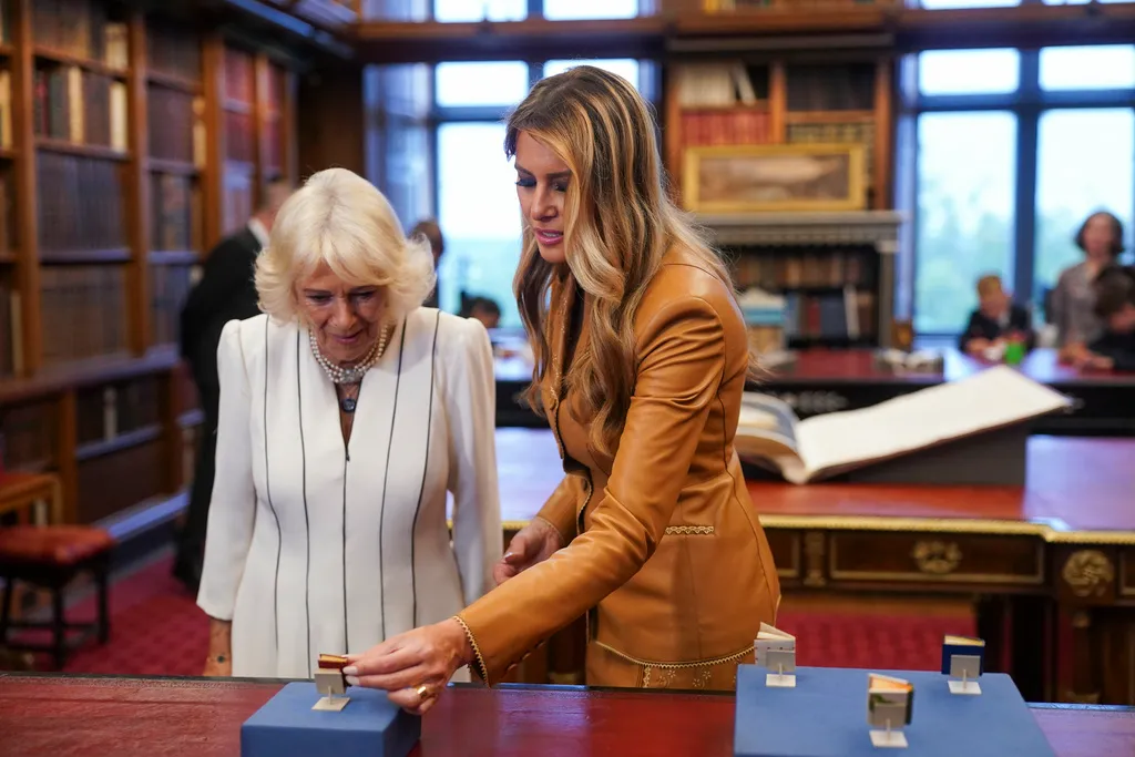 Britain's Queen Camilla and first lady Melania Trump, right, visit the Royal Library at Windsor Castle.