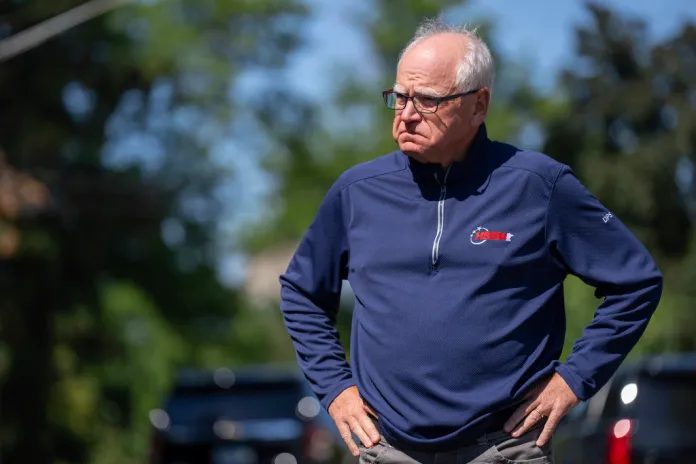 Minnesota Governor Tim Walz waits for a press conference to start outside Annunciation Church after a shooting earlier in Minneapolis, Wednesday, Aug. 27, 2025. (Alex Kormann/Star Tribune via AP)