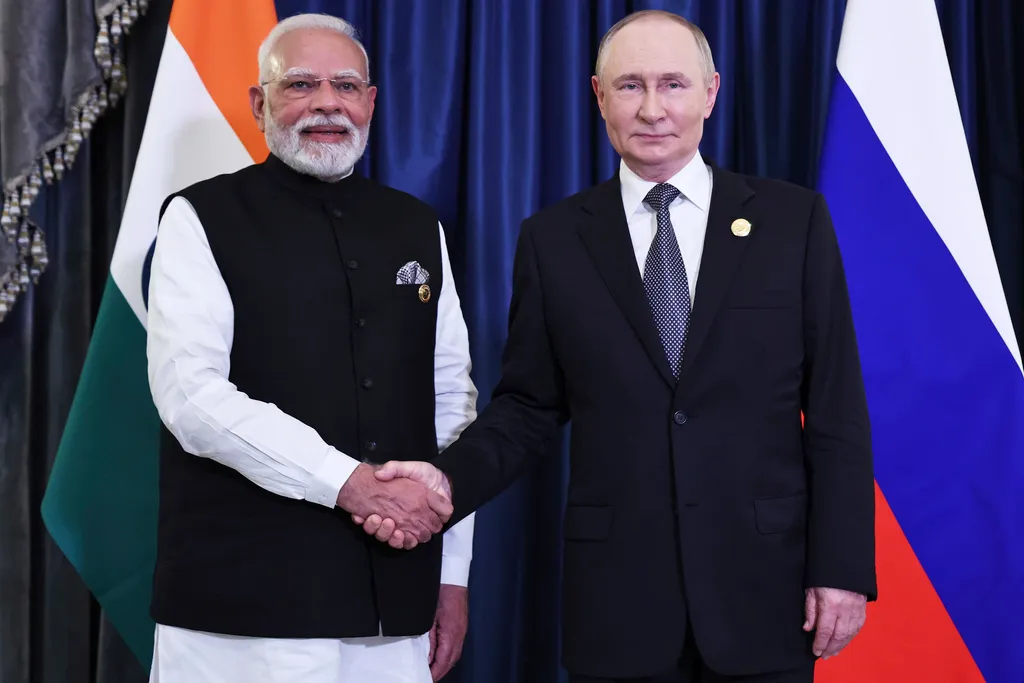 Indian Prime Minister Narendra Modi, left, and Russian President Vladimir Putin, right, shake hands during their meeting on the sidelines of the Shanghai Cooperation Organization summit on Monday, Sept. 1, 2025, in Tianjin, China.