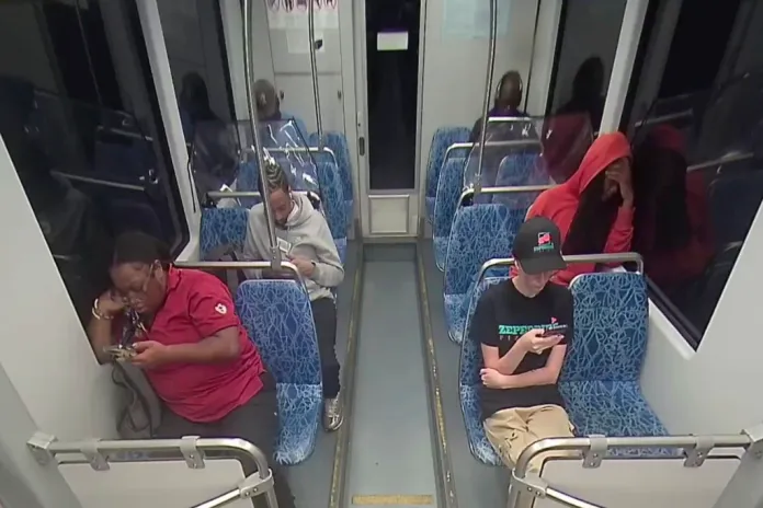 This screengrab made from video provided by the Charlotte Area Transit System shows Iryna Zarutska, bottom right, before she was fatally stabbed on a commuter train on Aug. 22, 2025. (Charlotte Area Transit System via AP)