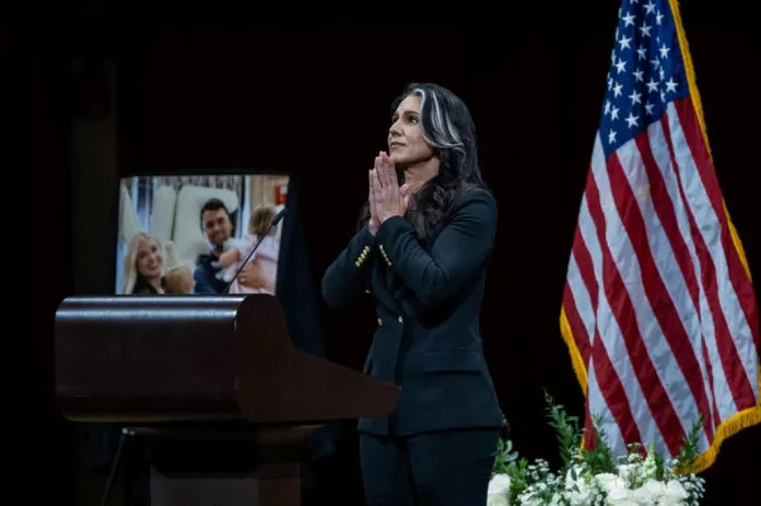 Gabbard prays at Kirk's DC vigil.